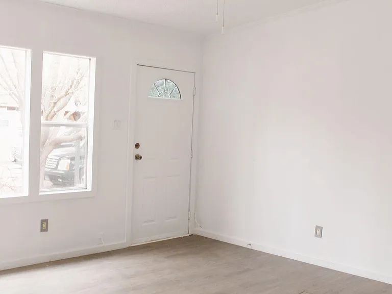 Living room area facing the front door