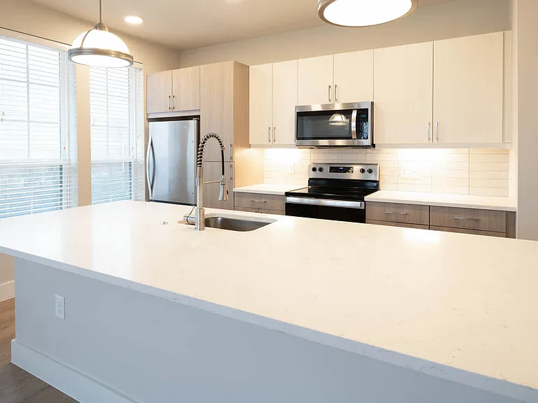 Kitchen with Stainless Steel Appliances and Breakfast Bar