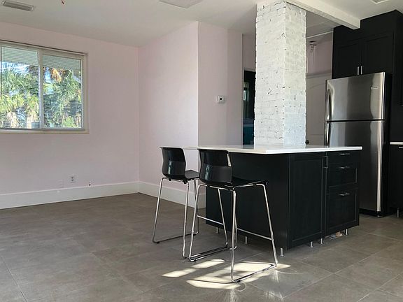 Open floor plan with dine in kitchen