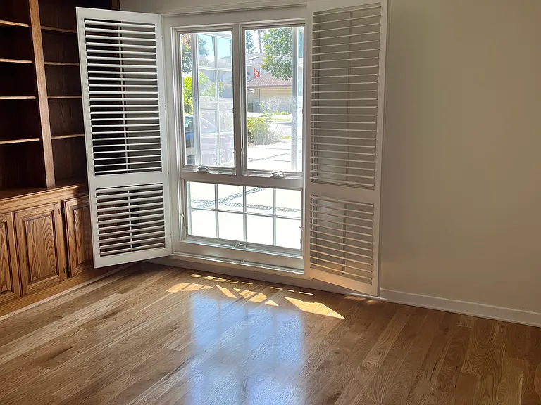 Bedroom #1 -Light filled with built in shelves and big closet.