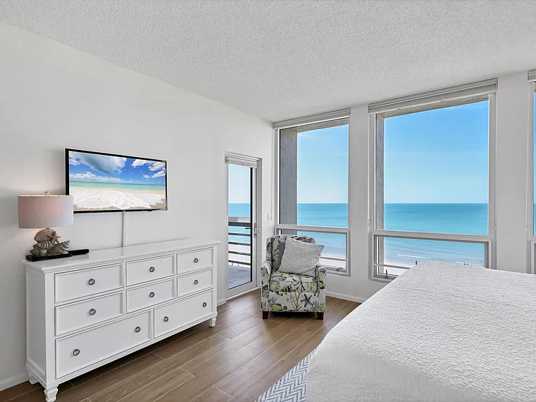 Access to beachfront balcony from primary bedroom.