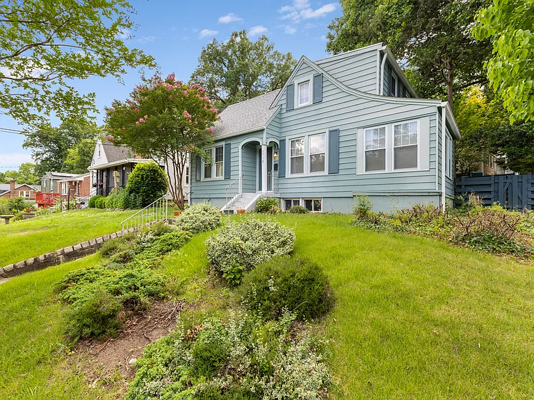 A wide look at the beautiful, deep front yard and gorgeous mature trees.