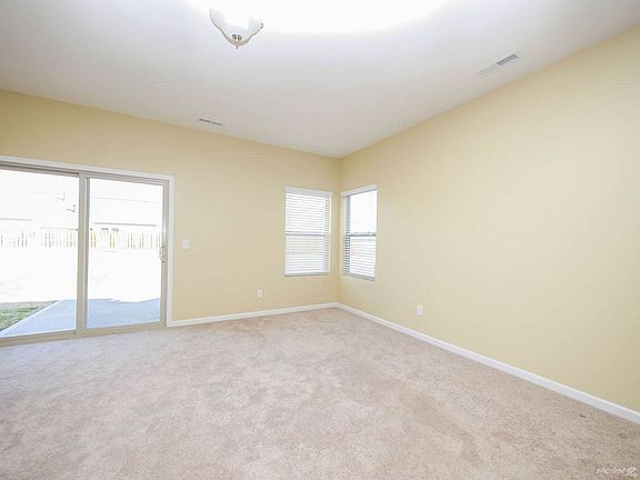 Sunny great room with access to patio