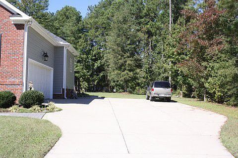 SIDE ENTRANCE GARAGE WITH SIDE WALK TO BACK