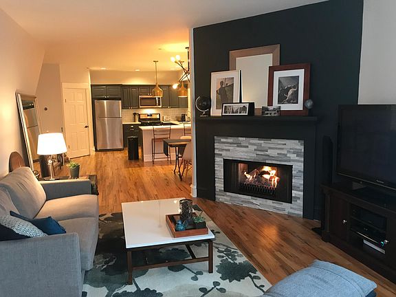 Living room with gas fireplace - open floor plan top floor