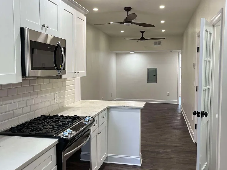Open layout kitchen leading to living room