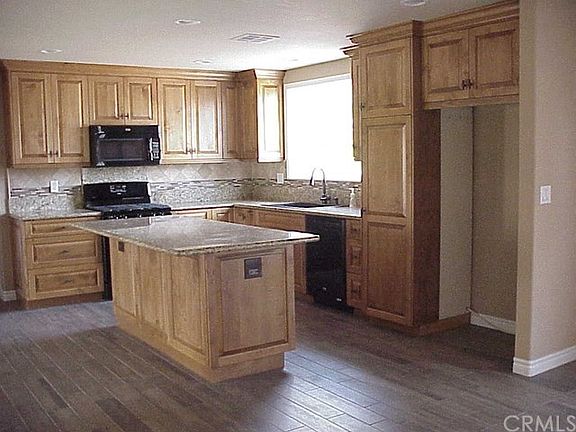 From the Dining Room Looking into the Completely Remodeled Kitchen.  Garden Window over the Sink Area