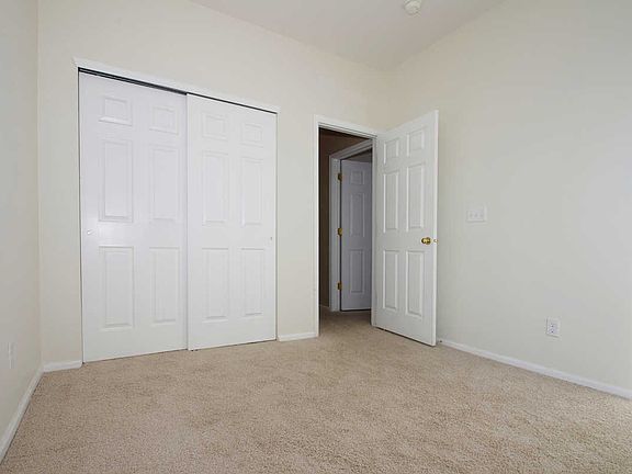  Bedroom 2 with vaulted ceilings and ceiling fan