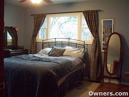 master bedroom with attached half bath