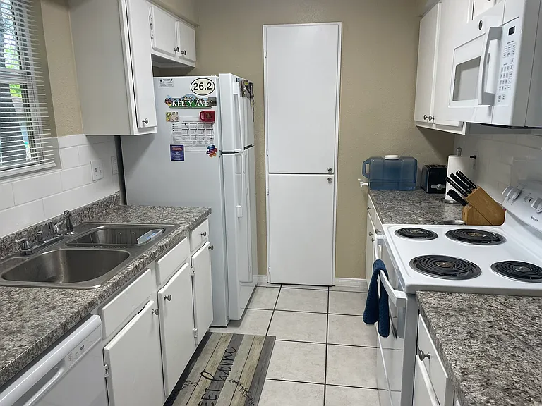 Kitchen has new dishwasher, new refrigerator with automatic ice maker, new stove and new built in microwave. Extra pantry space just added.