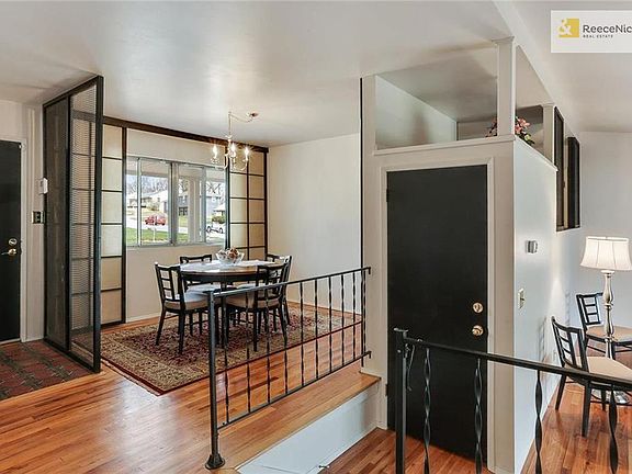 Bright formal dining room with hardwood floors