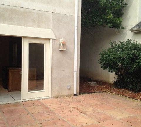 private courtyard and two car garage with opener