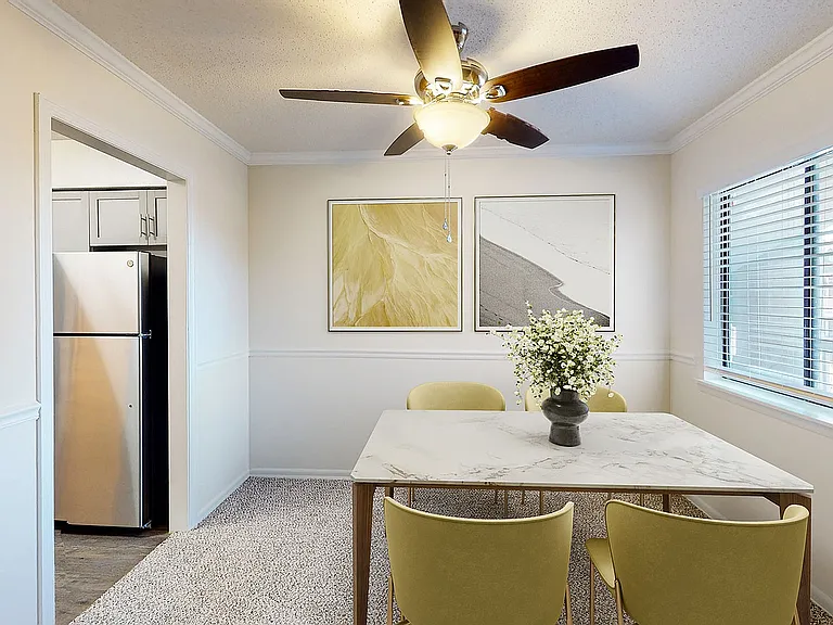 Dining area with carpet & overhead lighting