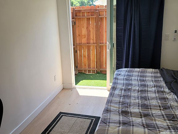 bedroom with exit to a small and private yard