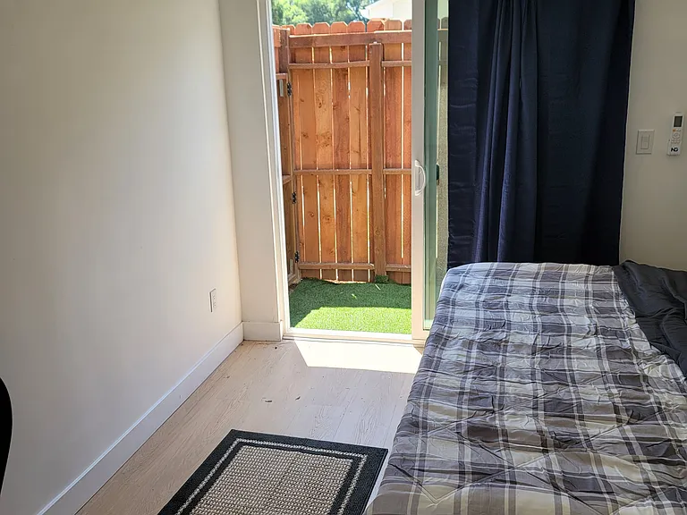 bedroom with exit to a small and private yard