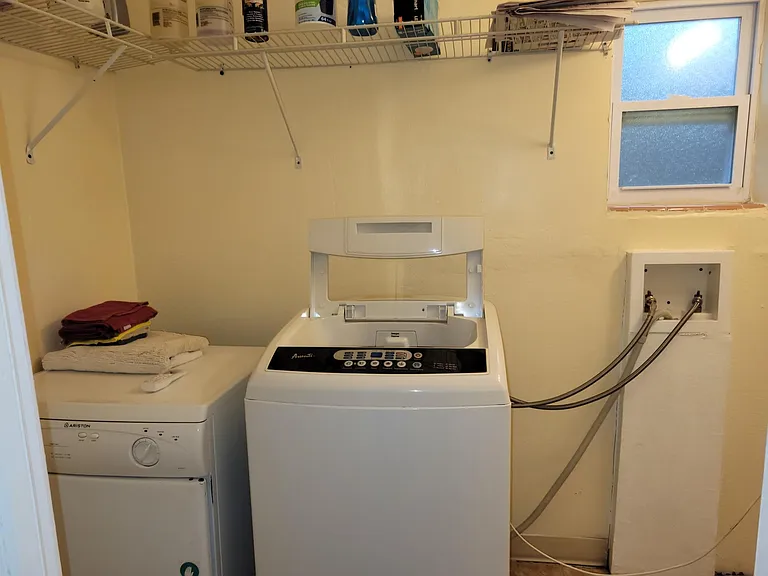 Indoor utility room with washer and dryer.