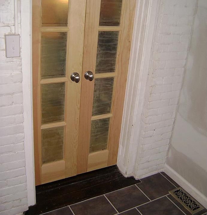 custom french drs/cer tile floor in laund. rm to kitchen