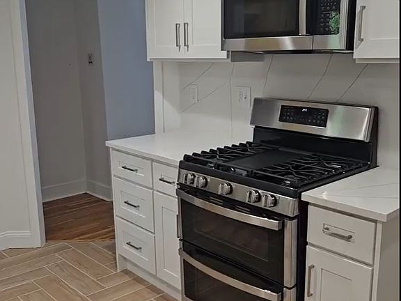 New porcelain tiled kitchen flooring in a herringbone pattern
