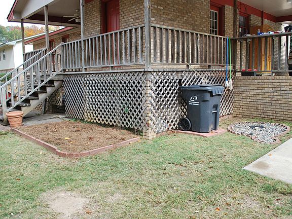 Porch deck is complete all way around back of the house. 8 x 10 utility room behind the red door