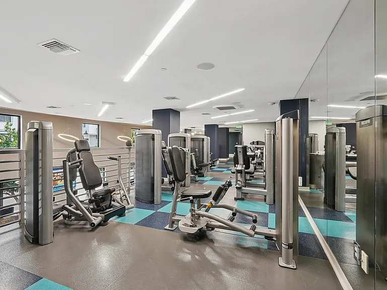 24/7 fitness center with cardio and strength training equipment