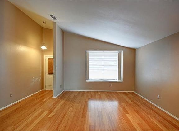 One of Two Living Areas - shown here is LR in front of house.  Use as a game room/front office/playroom -- you decide!