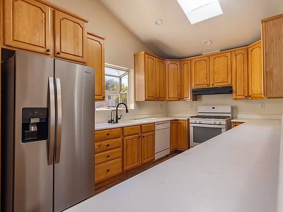 Stainless steal fridge gas stove and solid counters