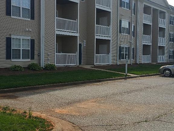 Parking area behind ground level condo.