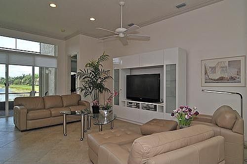 Large Family Room With Crown Molding And Great View Of Lake