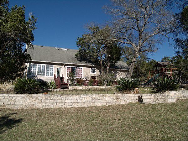 2.4 acre lot has lots of open space and private wooded back area.