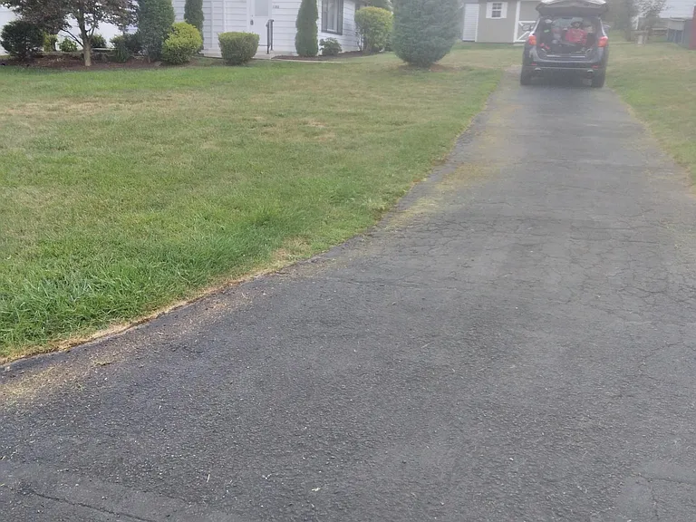 Front yard and driveway view from street