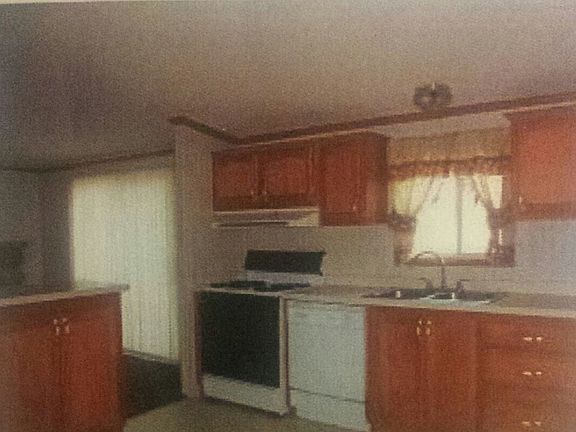 Kitchen has alot of cabinets