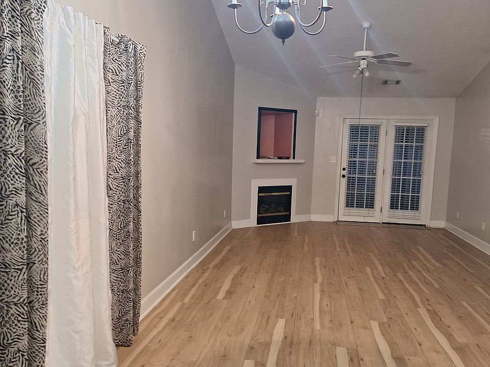 Living room with fireplace , door leads to back yard