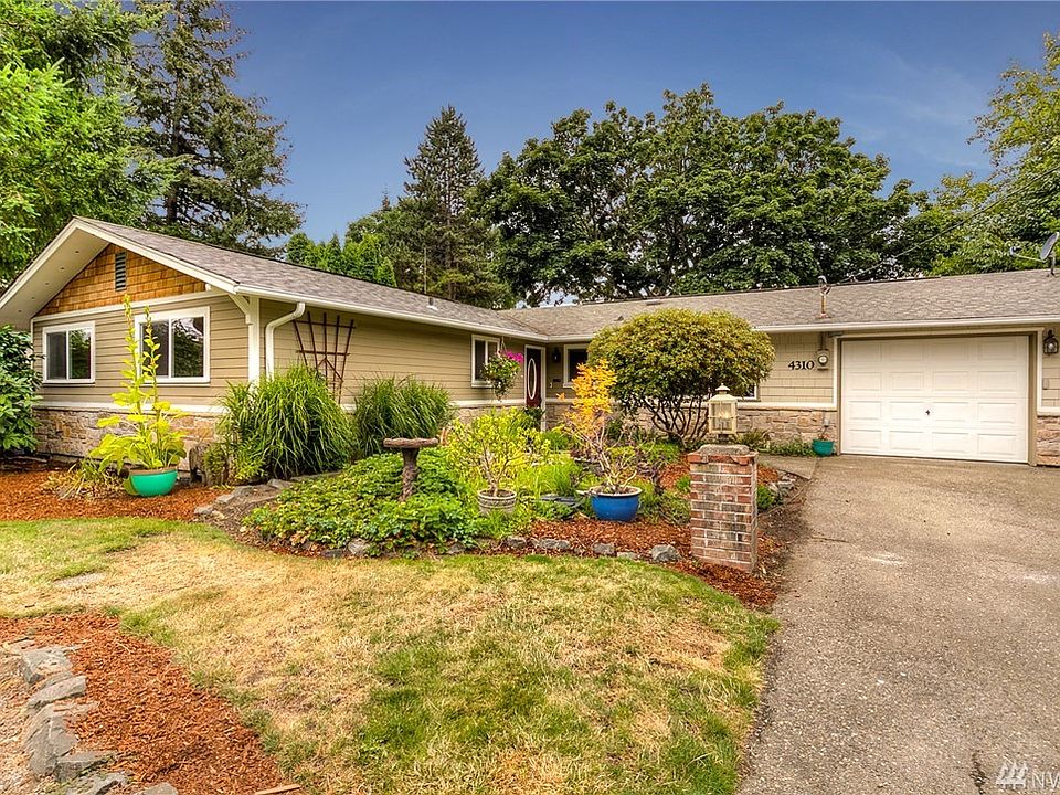 Highly sought after rambler with garage and detached shop.