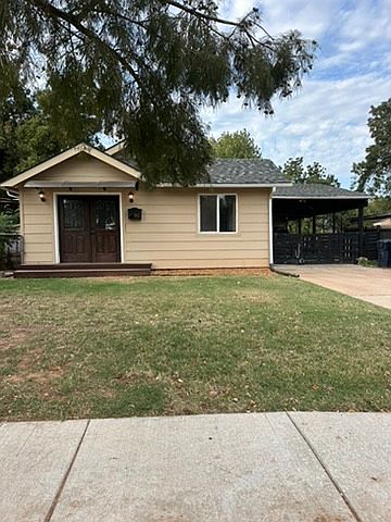 Double Front Doors, All new siding and windows, large driveway, and two car covered parking with gate