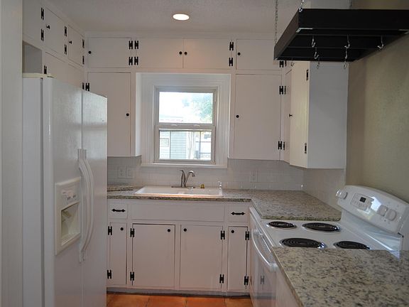 Kitchen with granite counter tops and new appliances, cute w