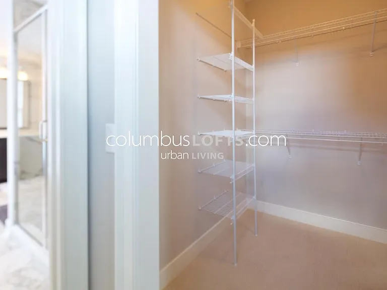 master bedroom walk-in closet between master bedroom and master bathroom