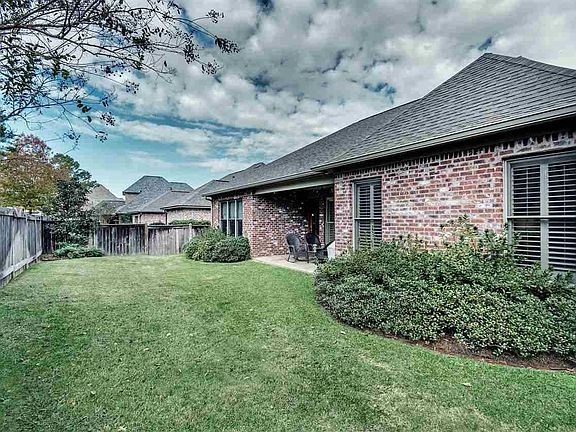 Fenced with a wooden privacy fence.