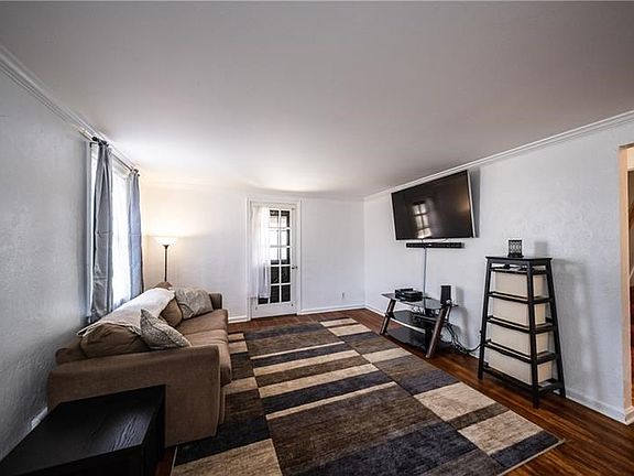 As you enter this lovely home you can spend time with the family in this spacious living area that has a door to the side covere