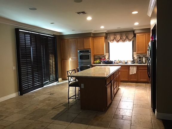 Kitchen with shutters on sliding door