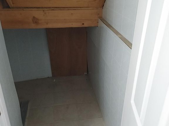 storage or crawl space under step