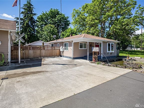 Beautiful pond out front. Parking for more than 8 cars in front.