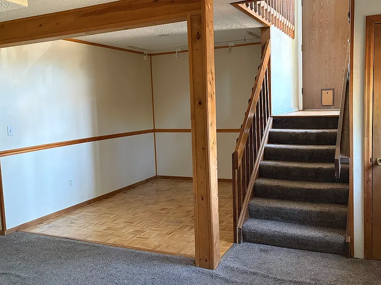 View towards Entry and Garage Access from Downstairs Living Room