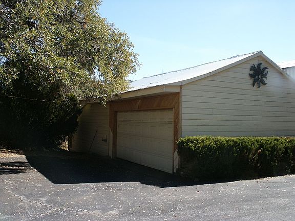 Two car garage with huge storage and workshop.