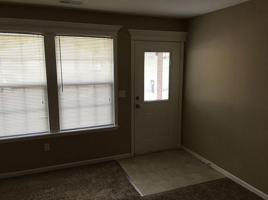 Living room has carpet