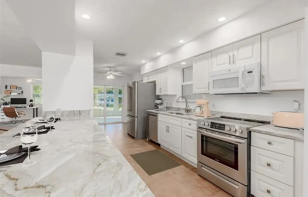 Brand new kitchen. Well lit with plenty of counter space. You will be the first to host family and friends for an epic meal in this kitchen. Pull out double garbage, stainless steel sink with garbage disposal. New refrigerator, stove, dishwasher. - 226 SE Lonita St