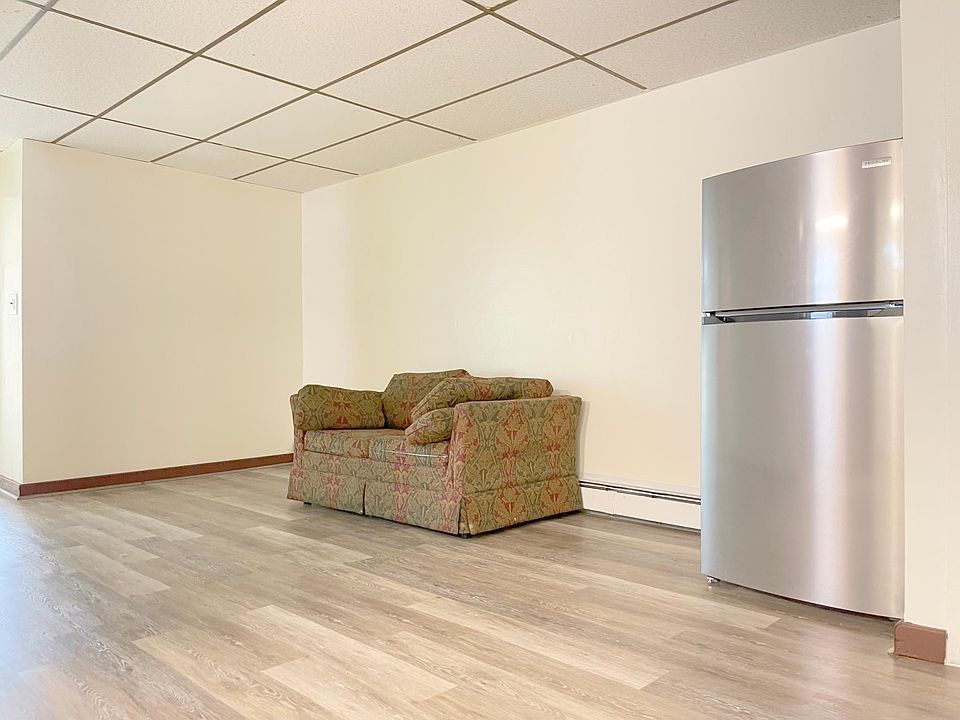 Dining and Living Room with Brand New Refrigerator. New floors