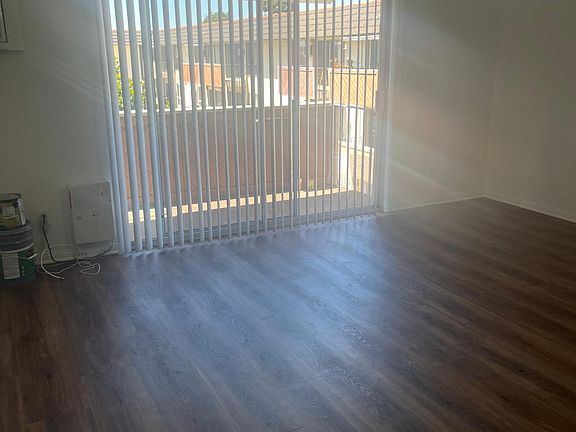Living area. Large slider with access to balcony.