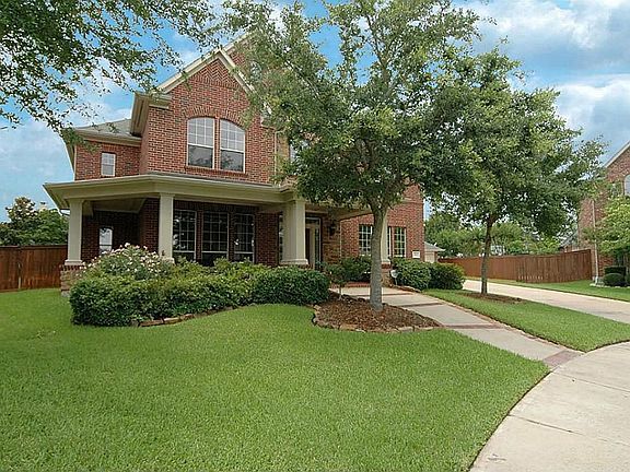 The home sits on a large cul-de-sac lot and is beautiful from all angles. You'll especially love the inviting porch entry accented by landscaping.