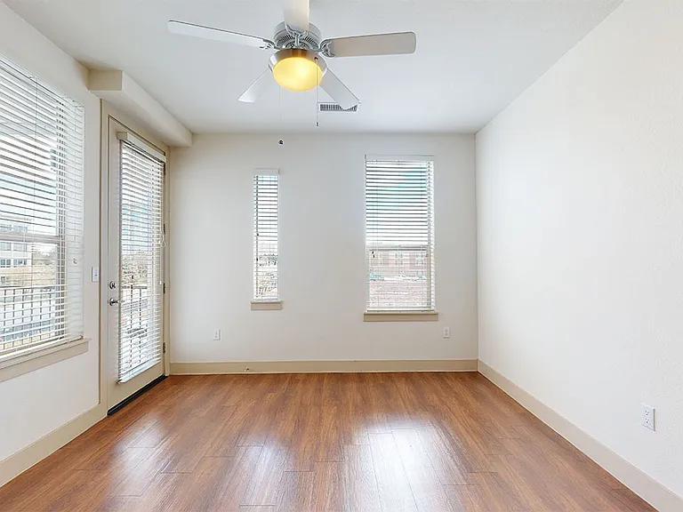 Apartment living room with wood-style flooring.