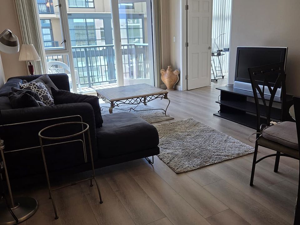 BRAND NEW HARDWOOD FLOORING INSTALLED FLOOR TO CEILING WINDOWS